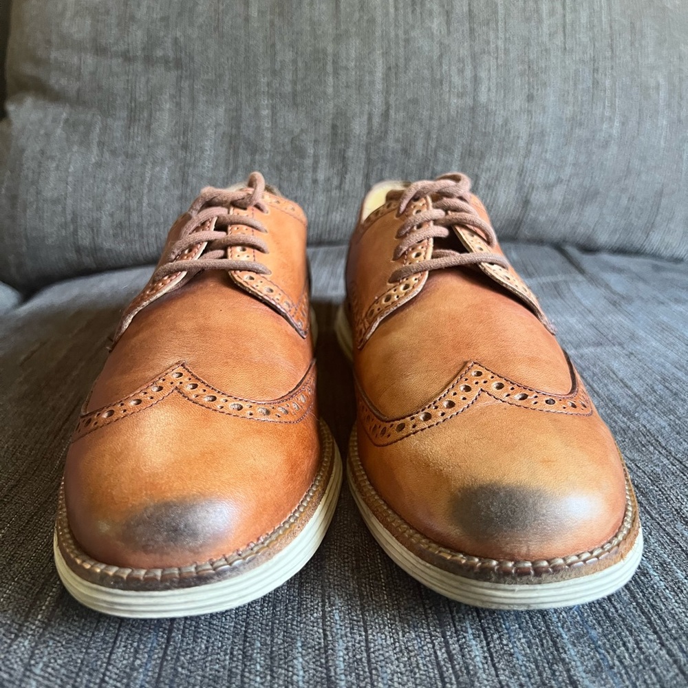 Mens size 8 Cole Haan brown wingtips with black toe.